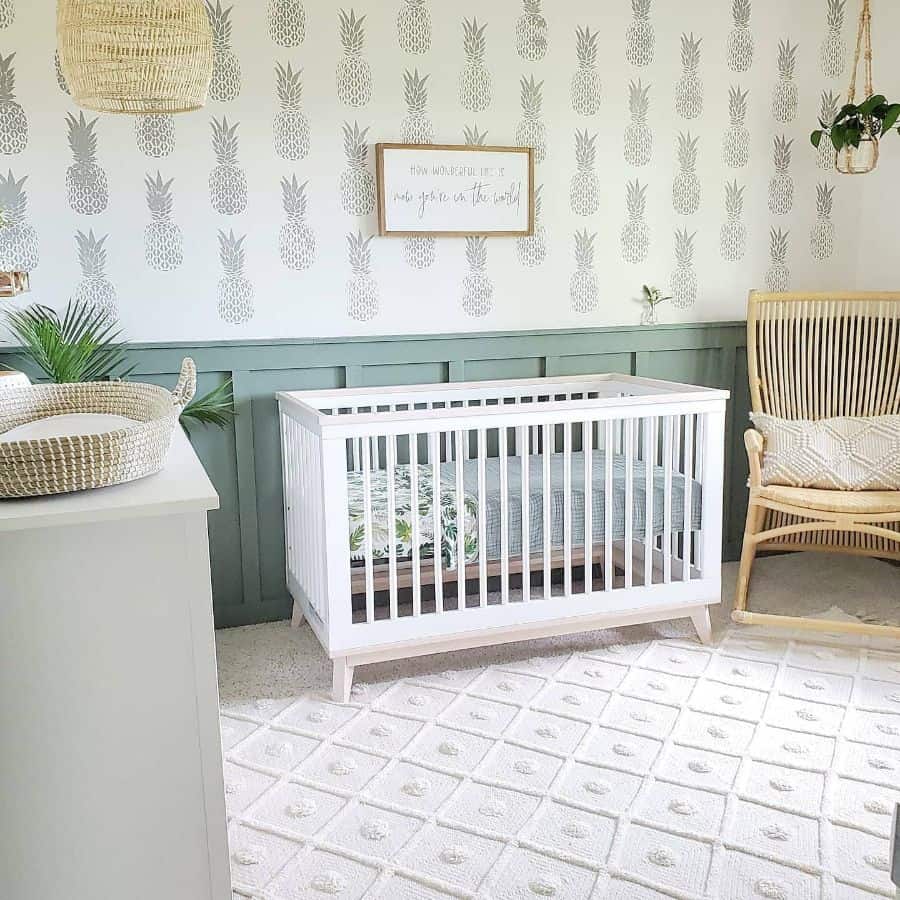 stylish nursery two tone green and pineapple wallpaper white crib wicker rocking chair