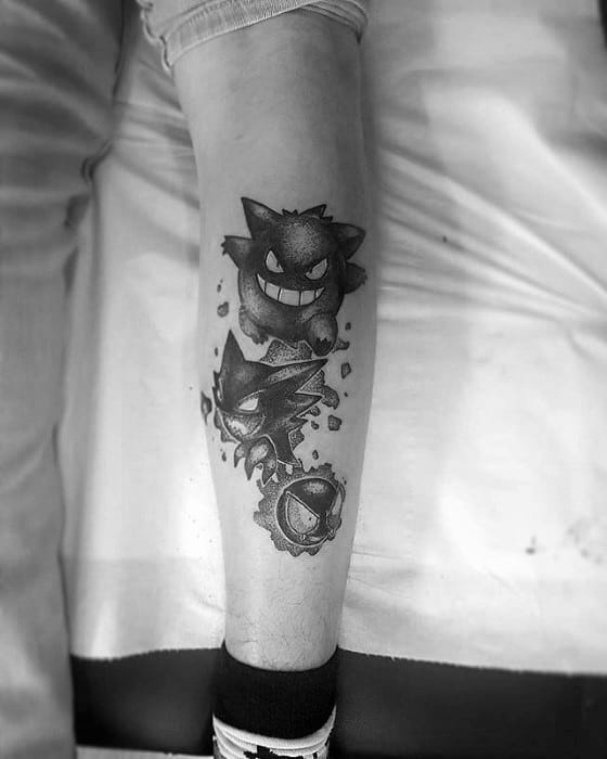 Black and grey tattoo of Gastly, Haunter, and Gengar in a vertical evolution sequence, with shattered effect and dynamic shading.
