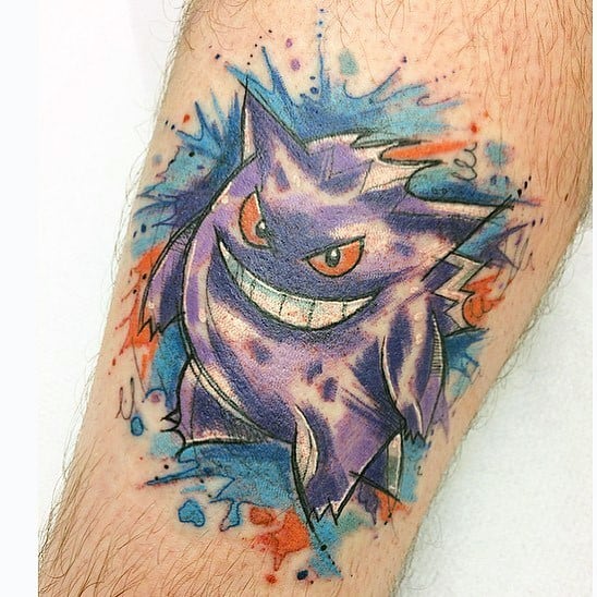 Watercolor-style Gengar tattoo with splashes of blue and red, giving the ghostly figure a vivid, artistic, and energetic look.