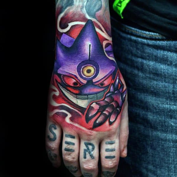 Striking Mega Gengar hand tattoo with a glowing third eye, sinister grin, and swirling red aura for an intense, powerful effect.