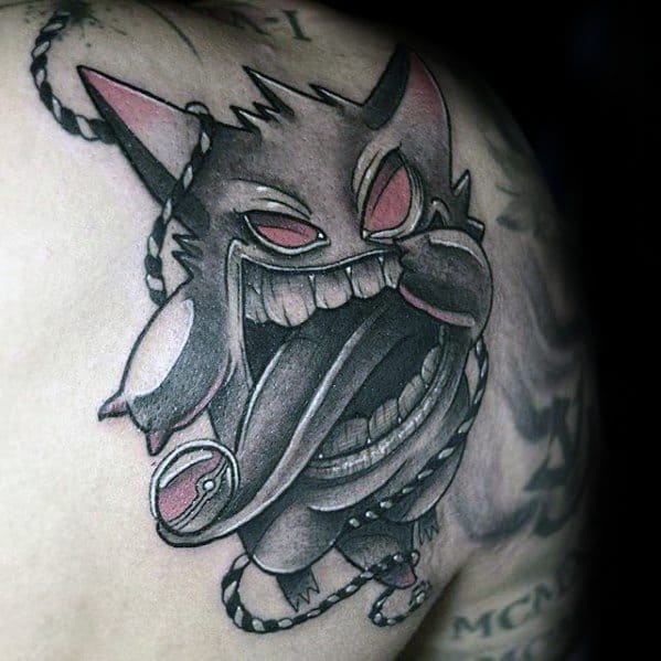 Monochrome Gengar tattoo with exaggerated mouth and tongue, featuring bold outlines, red eyes, and dynamic rope-wrapped design.
