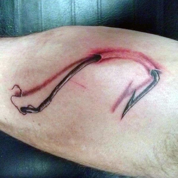Gentlamn With Hooked Fish Hook On Skin Bicep Tattoos