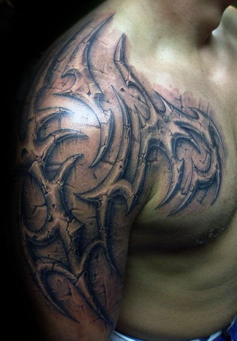 Gentleman With 3d Stone Tribal Upper Chest And Half Sleeve Tattoo