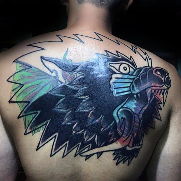 Blast over back tattoo of a colorful, abstract wild animal head with sharp teeth