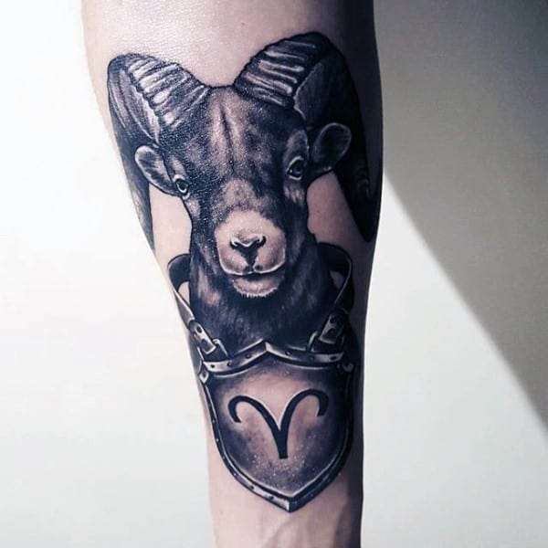 Gentleman With Aries Ram And Shield Tattoo On Inner Forearm