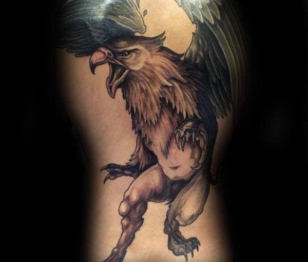 Gentleman With Back Tattoo Of Griffin