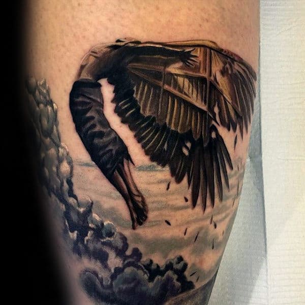 Gentleman With Black Icarus In Clouds Arm Tattoo