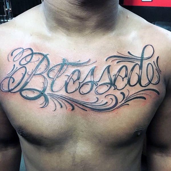 Gentleman With Blessed Lettering Script Tattoo On Upper Chest