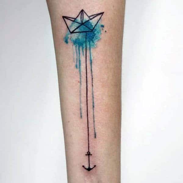 Gentleman With Blue Ink Watercolor Origami Tattoo Of Sailboat With Black Ink Anchor On Forearm