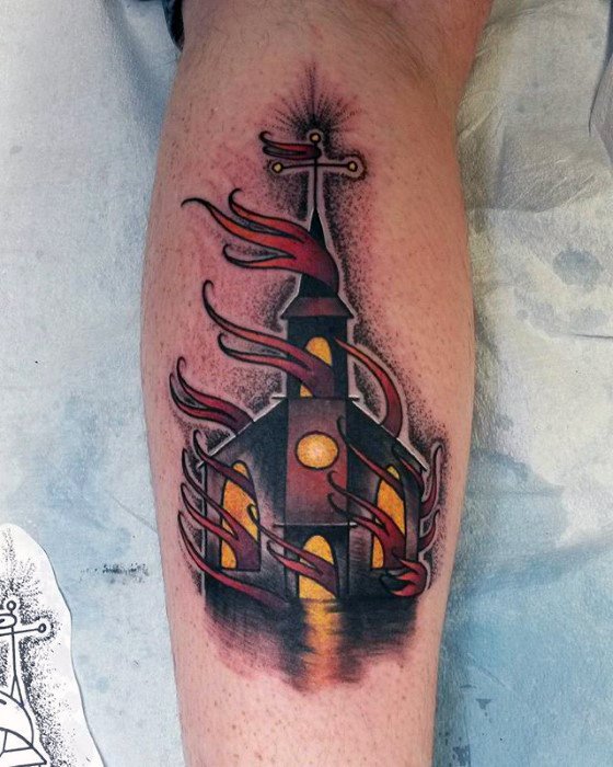 Colorful burning church tattoo with glowing yellow windows and swirling red flames. Reflections at the base add a dramatic touch.