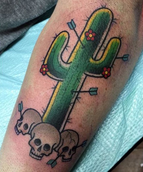 Gentleman With Cactus Arrows And Skull Tattoo On Arm