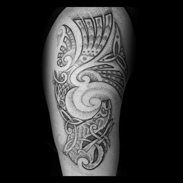 Dotwork Celtic tattoo on calf with swirling shapes, knot patterns, and a stylized wolf head blending into tribal-style elements.