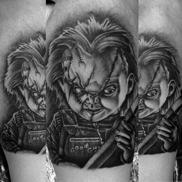 Black and grey Chucky tattoo with intense shading, featuring his stitched face, eerie grin, and a weapon for a dark horror-inspired design.