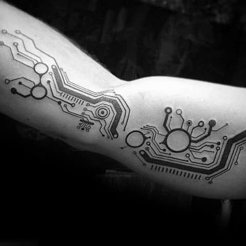 Black ink tattoo of abstract circuit board lines and nodes flowing across the inner arm, resembling electronic pathways.