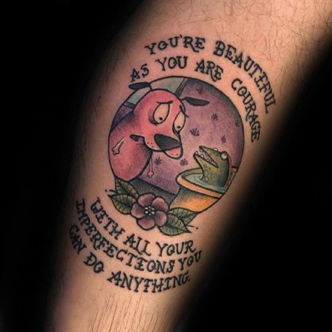 Courage the Cowardly Dog tattoo with an inspiring quote, showing Courage looking at a frog in a tub under a purple sky and flower below.