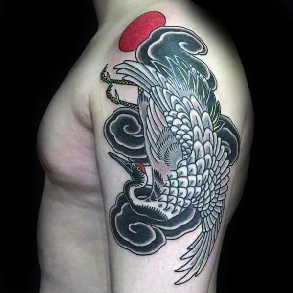 Gentleman With Crane And Black Clouds Upper Arm Tattoo