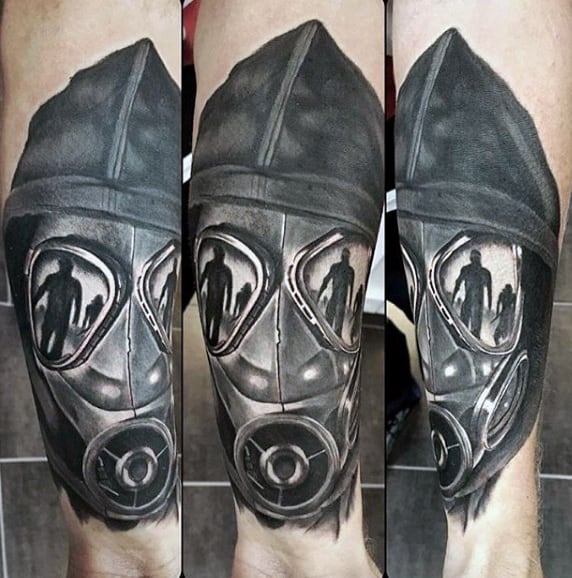 Gentleman With Creative Gas Mask Tattoo On His Wrist