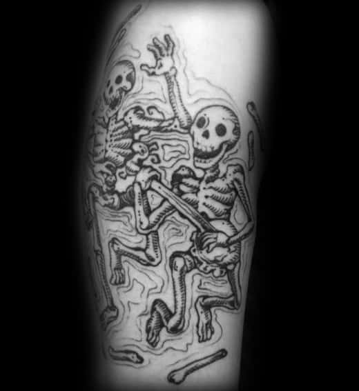 Tattoo of two dancing skeletons with bold black ink and swirling background details, creating a lively and dynamic design.
