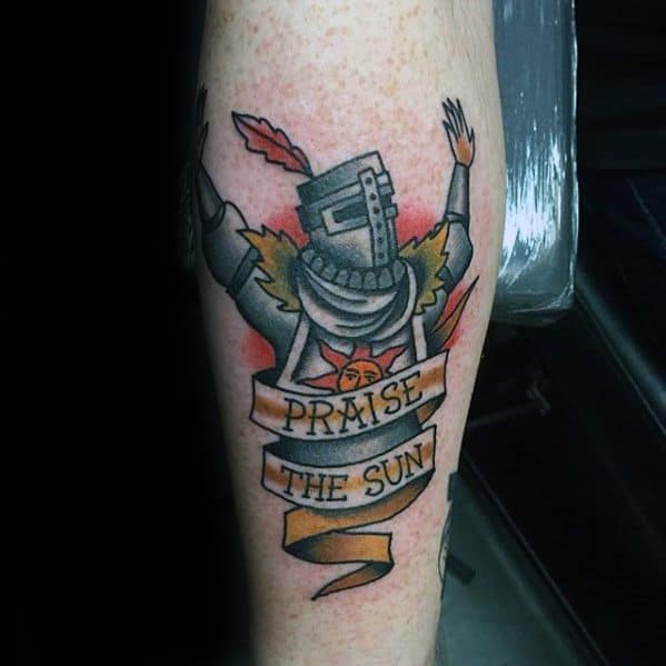 Colorful tattoo of Solaire of Astora with arms raised and a flowing "Praise the Sun" banner, inspired by Dark Souls.