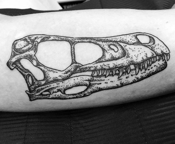 Gentleman With Detailed Velociraptor Skull Arm Tattoo