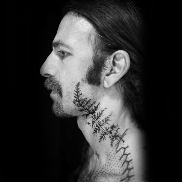 Gentleman With Fern Neck And Face Tattoo Abstract