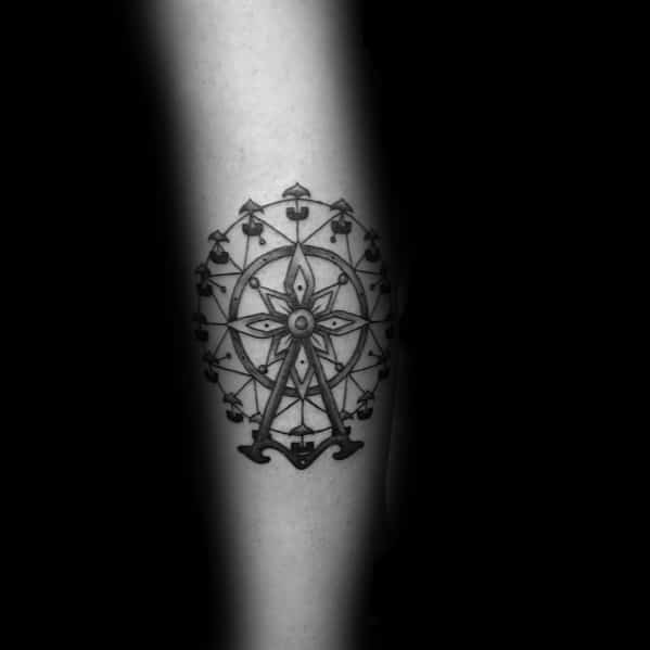 Intricate Ferris wheel tattoo with ornamental details and fine linework, featuring a symmetrical floral-inspired center for an artistic touch.