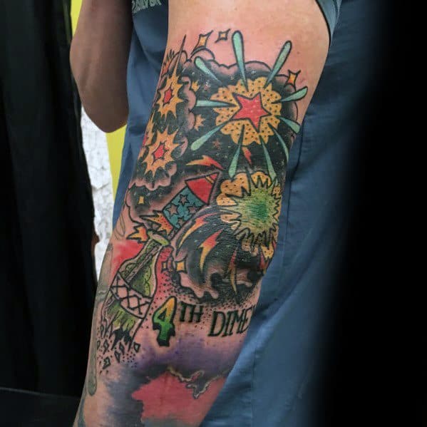 Colorful tattoo featuring fireworks exploding in vibrant shades, with a rocket, smoke, and "4TH DIM" text, creating a bold and dynamic design.
