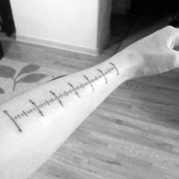 Gentleman With Forearm Ruler Tattoo