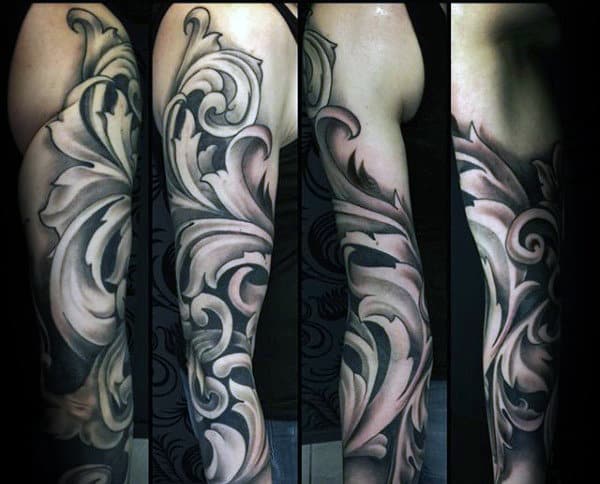 Gentleman With Full Sleeve Tattoo Of Filigree Design