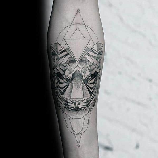 Forearm tattoo of a geometric tiger with layered triangles, sharp shading, and symmetrical lines for a bold futuristic style.
