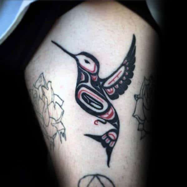 Gentleman With Haida Hummingbird Tattoo On Thighs