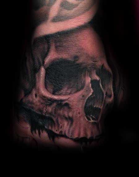 Gentleman With Hand Tattoo Of Shaded Black And Grey Skull Designs
