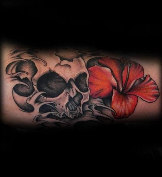 Gentleman With Hibiscus Flower And Skull Tattoo On Inner Arm