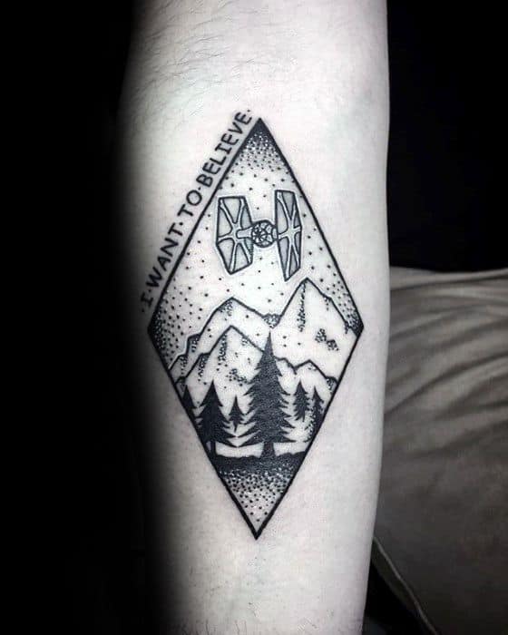 Gentleman With I Want To Believe Tattoo On Inner Forearm