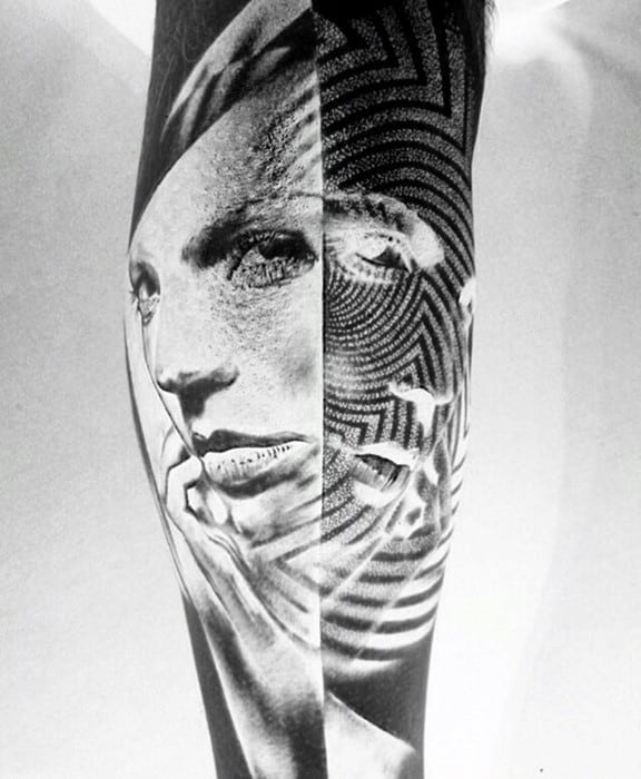 Inverted tattoo split between a realistic woman’s face and a geometric maze pattern, creating a surreal dual-effect design.