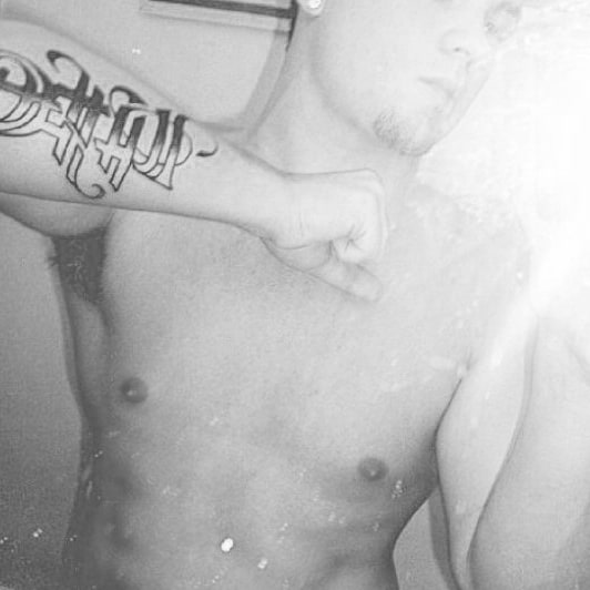 Gentleman With Life Death Ambrigram Tattoo On Outer Forearm