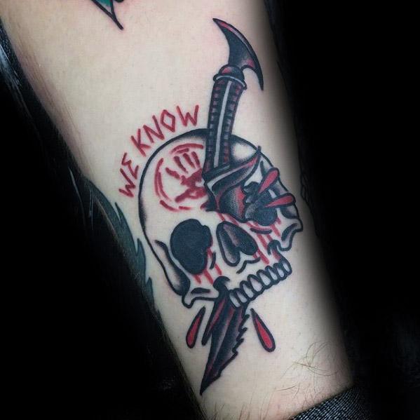 Tattoo of a Skyrim skull with a dagger, featuring "We Know" in striking red text