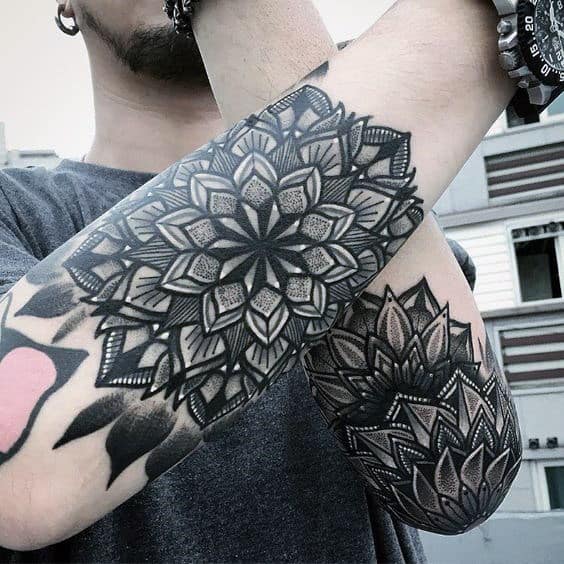 Gentleman With Mandala Tattoos On Outer Forearms
