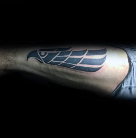 Gentleman With Manly Tribal Eagle Back Of Leg Tattoo