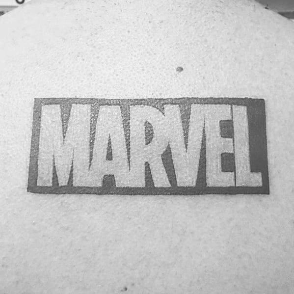 Gentleman With Negative Space Marvel Logo Upper Back Tattoo