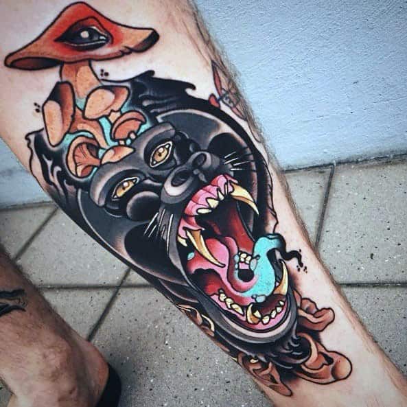 Neo-traditional tattoo of a roaring gorilla with mushrooms, an all-seeing eye, and a blue snake coming from its mouth.