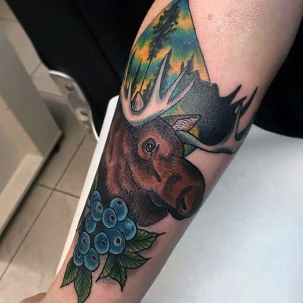 Gentleman With Old School Moose And Blueberries Tattoo On Forearm