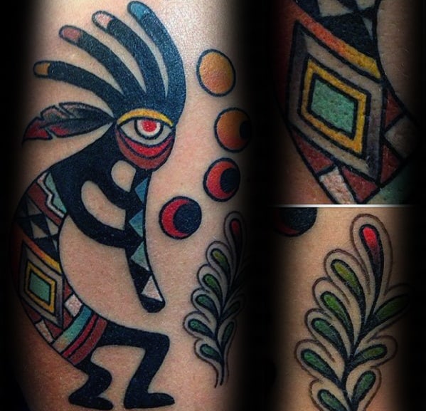 Colorful Kokopelli tattoo with bold tribal patterns, vibrant geometric shapes, and decorative plants and orbs for a lively Southwestern vibe.