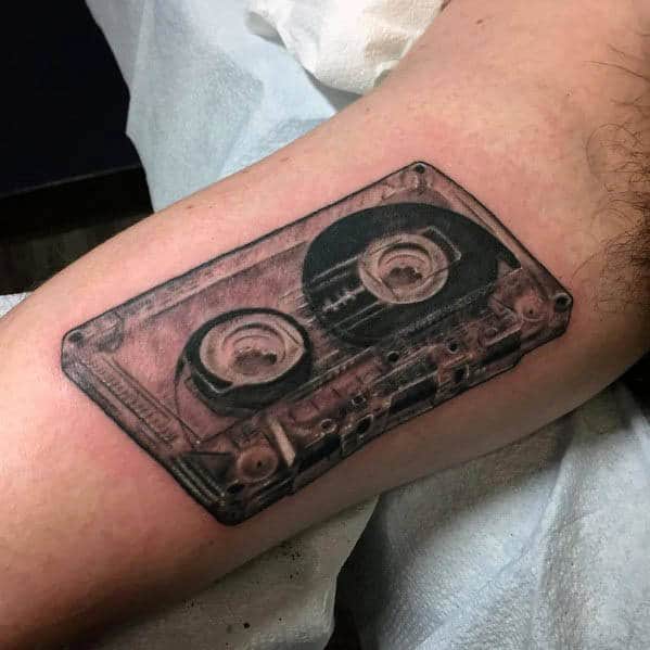 Gentleman With Realistic Cassette Tape Tattoo Design On Inner Arm