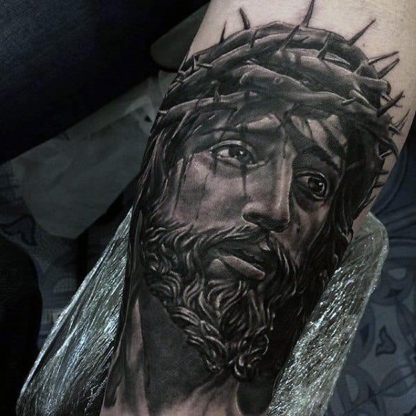 Gentleman With Realistic Jesus Portrait Arm Tattoo