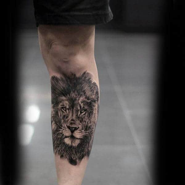 Gentleman With Realistic Shin Tattoo Of Lion