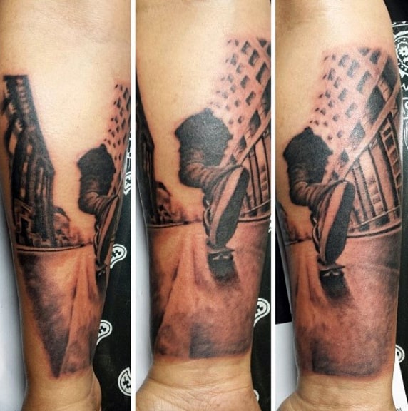 Gentleman With Realistic Skateboard Riding Tattoo On Wrist