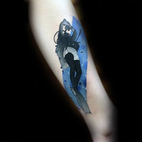 Stylized scuba diver tattoo with a soft watercolor blue background, featuring a female diver in a graceful swimming pose.