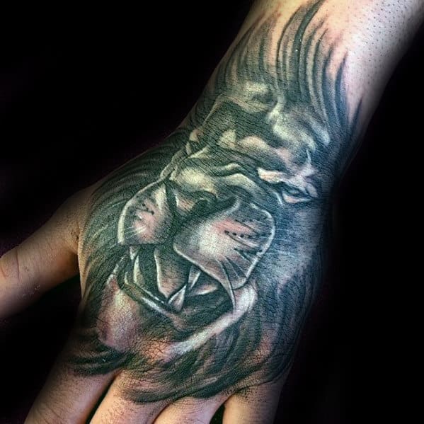 Gentleman With Shaded Grey And Black Hand Tattoo With Lion Design