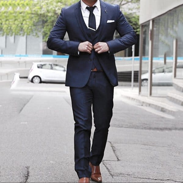Gentleman With Sharp Navy Blue Suit Style With Brown Dress Shoes And White Pocket Square